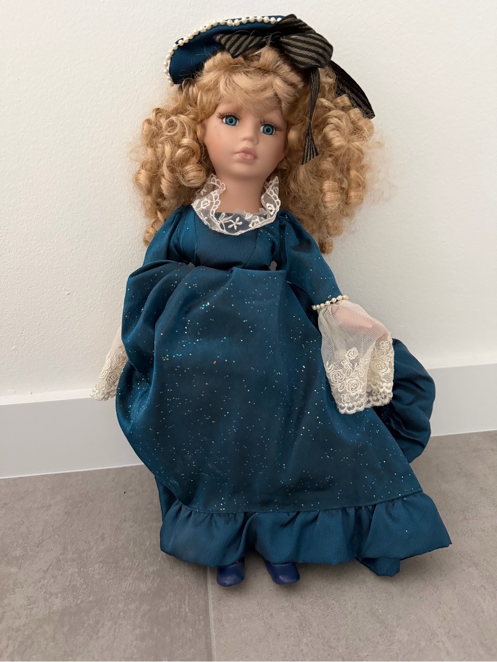 Blue Vintage-Style Porcelain Doll with Curly Blonde Hair